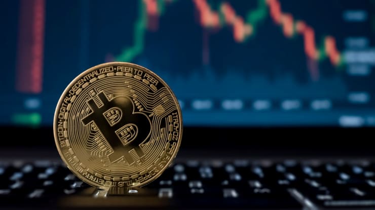 106893887 1623167512779 bitcoin digital crypto currency with stock market candlesticks on computer screen rltheis t20 W7xVwY - رمزارز ها در 50 سال آینده چه جایگاهی خواهند داشت؟